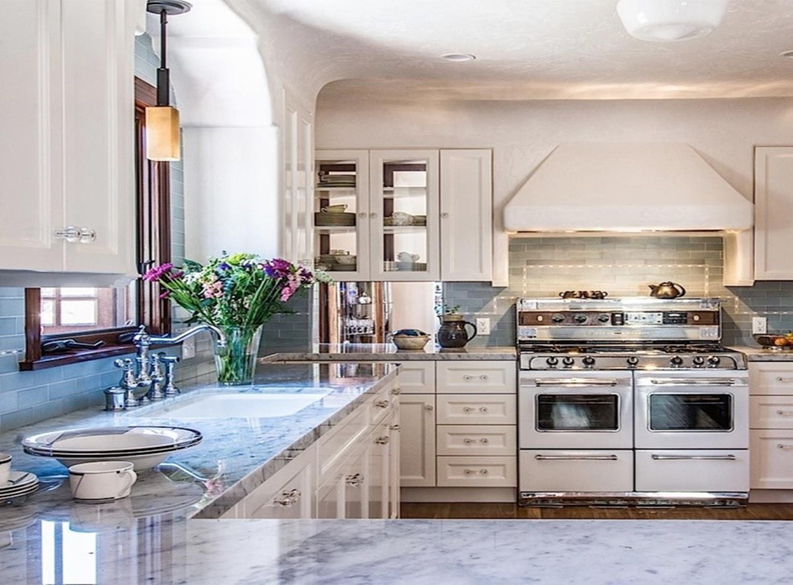 Marble tops, natural light, elegance, and a Hamptons-style kitchen for a client who loves to cook. 